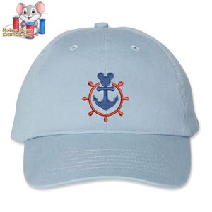 May include: A light blue baseball cap with an embroidered design of a blue anchor and a red ship's wheel. The anchor has a Mickey Mouse head on top. The hat has a curved brim and a button on top.