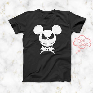 May include: Black t-shirt with a white graphic of Jack Skellington from The Nightmare Before Christmas, designed to look like Mickey Mouse.