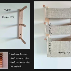 May include: A wooden wall-mounted storage unit with three fabric baskets. The unit is 26 inches tall, 18 inches wide, and each basket is 8.5 inches deep. The unit is made of natural wood and can be stained in a variety of colors, including black, walnut, and natural.