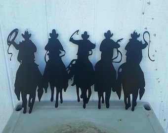 Riding cowboys silloutte 15 x 25 with s hooks for hanging