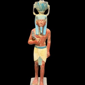Pretty Nefertum statue the ancient Egyptian God Nefertem God of healing and beauty in ancient Egyptian mythology sculpture diety statue