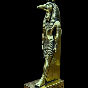 Thoth - Egyptian statue of god of wisdom and knowledge covered by gold leaf / Egyptian mythology / ancient Egyptian / made in Egypt.