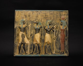 Wall hanging, ancient relief contains king Ramses II with God Anubis and king Tutankhamun with goddess Hathor, made of stone, made in Egypt.