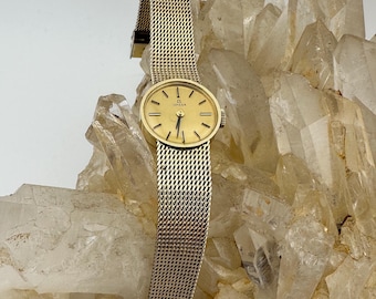 Orologio da donna Omega meccanico (a carica manuale) con cinturino regolabile in maglia placcata oro 14 carati.
