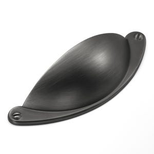 May include: A matte black metal cup pull handle with a smooth, curved, semi-circular design. The hardware features a brushed finish and includes two integrated mounting points on the flat base, each containing a visible flathead screw slot.