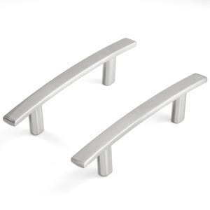 May include: Two silver-colored metal cabinet pulls with a brushed finish. Each handle features a slightly arched, rectangular bar design supported by two cylindrical posts, providing a clean and functional aesthetic for furniture or cabinetry hardware.
