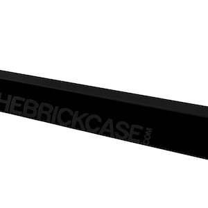 May include: Black rectangular box with the text "THEBRICKCASE.COM" printed on the top.