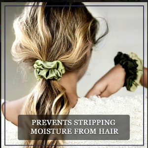 May include: Green satin scrunchies for hair.  The text "PREVENTS STRIPPING MOISTURE FROM HAIR" is on the bottom of the image.
