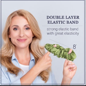 May include: A green double layer elastic hair scrunchie with a diameter of 8 inches. The scrunchie is made of a soft, silky material and is designed to be gentle on hair.