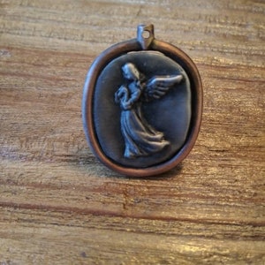 Pocket angel with copper band