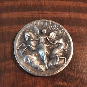 Angel with two horses