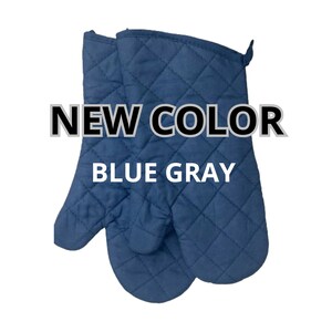 May include: A pair of blue quilted oven mitts.  NEW COLOR BLUE GRAY.