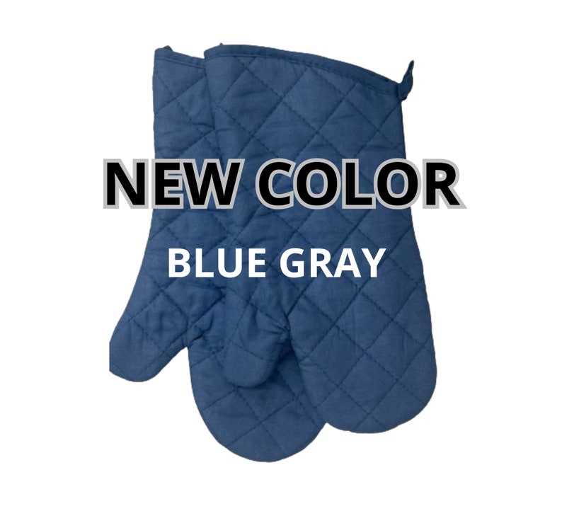 May include: A pair of blue quilted oven mitts.  NEW COLOR BLUE GRAY.