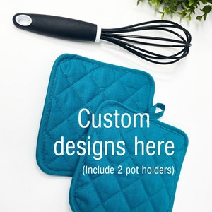 May include: Two teal blue quilted pot holders with the text "Custom designs here (Include 2 pot holders)" in white.