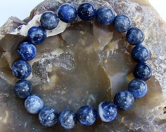 Bracciale uomo Sagapò con sfere occhio di tigre rosso srt17