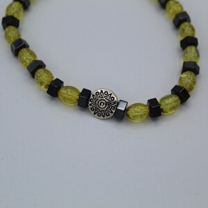 Hand-Crafted Stretch band Yellow crackle glass bead pentagon hematite beads with silver medallion bracelet