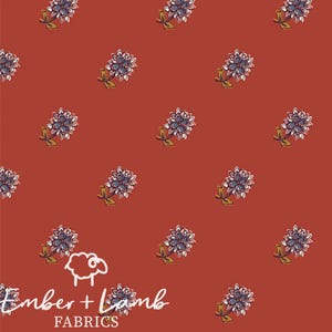 May include: A seamless pattern featuring a repeating design of small, stylized floral motifs in shades of blue, white, and yellow on a solid rust-colored background. The pattern is repeated throughout the image.