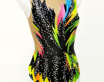 May include: A black leotard with a colorful flame design and rhinestones. The leotard has a scoop neck and a sleeveless design.