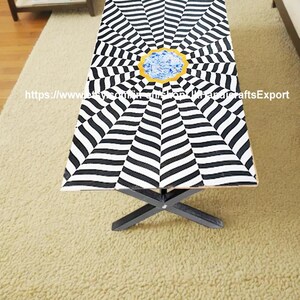 May include: A rectangular coffee table with a black and white striped pattern radiating from a central gold-colored circle with a blue design. The table has black legs and is on a beige rug. Text on the image: etsy.com/shop/IndianCraftsExport.