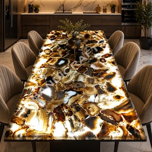May include: A rectangular dining table with a backlit, agate stone top. The table features a dark base and is surrounded by six beige upholstered chairs. The agate stone top has a mix of brown, white, and amber tones, creating a unique and luxurious look.