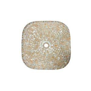 May include: Square, mosaic-style sink basin with a central drain hole. The basin is made of small, irregularly shaped beige and cream-colored stones, creating a textured surface. The edges are rounded, and the overall design is symmetrical.