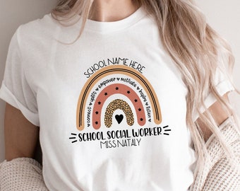 May include: White t-shirt with a rainbow design featuring the words "School Name Here", "School Social Worker", and "Miss Nataley". The rainbow is made up of peach, orange, and pink stripes with a leopard print pattern in the middle. The words "connect", "unify", "empower", "motivate", "inspire", and "listen" are written around the rainbow.