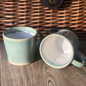 Handmade green ceramic stoneware mug in a two tone glaze.  Duck egg blue and white