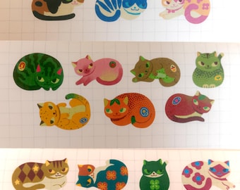 May include: A collection of twenty-three individual cat stickers arranged in three rows on a white grid background. Each sticker features a unique cat illustration with various colors, patterns, and poses, including solid, spotted, and floral designs.