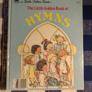 May include: A Little Golden Book titled "The Little Golden Book of Hymns" with a blue cover and a picture of children singing in a church.