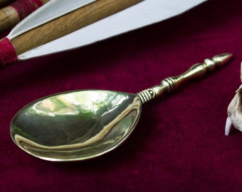 Medieval brass spoon from the Cluny museum. Copy of artifact for the late 14th - 15th-century reenactment
