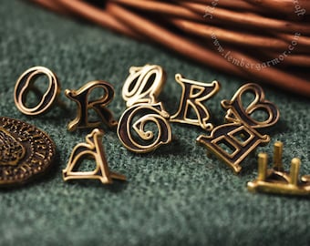 Gold(brass) medieval mounts Latin Letters. Alphabet belt decoration and pins for medieval costume and belt.