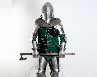 May include: A full suit of silver armour with a green and black padded undergarment. The armour includes a helmet with a visor, gauntlets, and greaves. The figure is holding a wooden-handled axe.