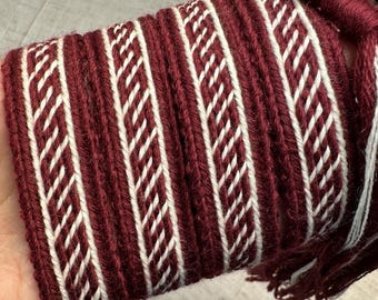 Tablet-woven wool belt. Inspired by Oseberg find Norway, 9th. Viking reenactment. Used 9 tablet cards: Burgundy and White.