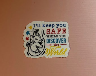 May include: White sticker with a black and white illustration of an elephant holding onto its trunk. The text on the sticker reads "I'll keep you safe while you discover the world" in colorful letters.