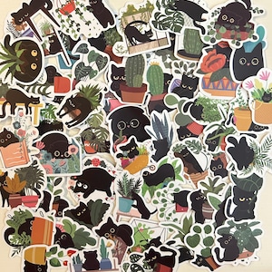 May include: A set of black cat stickers with various poses and designs. The stickers feature black cats in different settings, including plants, flowers, and geometric shapes. The stickers are perfect for adding a touch of whimsy to journals, laptops, water bottles, and other surfaces.