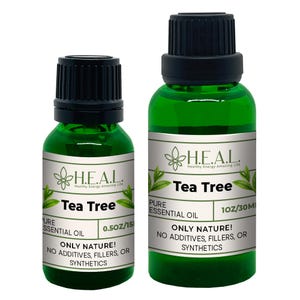 May include: Two bottles of Tea Tree essential oil, one 0.5 oz and one 1 oz, with green labels and the text "H.E.A.L. Healthy Energy Amazing Life" and "Only Nature! No additives, fillers, or synthetics".