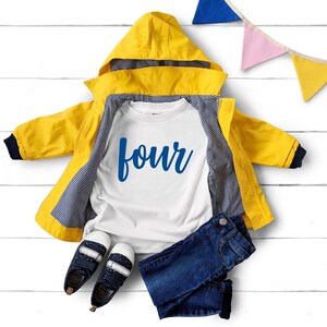 May include: A white t-shirt with the word "four" written in blue cursive lettering. The shirt is layered over a yellow raincoat with a blue and white striped lining. Blue jeans and a pair of blue shoes are also included in the image.