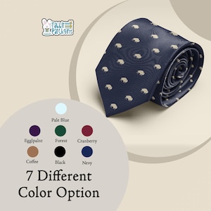 May include: A navy blue tie with a repeating pattern of small, light tan shapes. The tie is rolled up, displaying its texture and design. The image also shows a color palette with seven different color options, including navy, black, and cranberry.