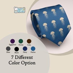 May include: A blue necktie featuring a repeating pattern of light beige jellyfish. The image includes a logo for Rabbit Patch Gifts and a color chart displaying seven different color options labeled Eggplant, Forest, Cola, Slate, Black, Navy, and Patina.