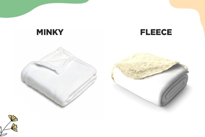 May include: Two folded blankets are displayed side by side. The left blanket is labeled MINKY and is solid white with a smooth texture. The right blanket is labeled FLEECE and features a white exterior with a textured, cream-colored interior lining.