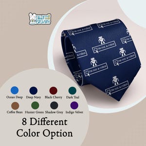 May include: A deep navy blue necktie featuring a repeating white graphic pattern of small robots and checkboxes with the text "I'm not a robot" accompanied by a cursor icon. The design is printed across the fabric of the necktie.