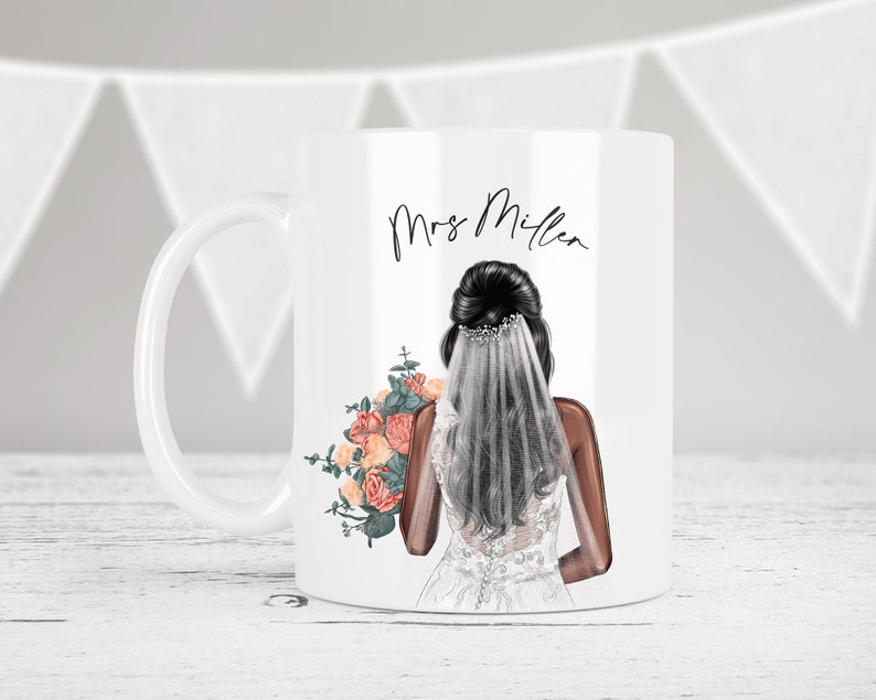 May include: White ceramic mug with a black and white illustration of a bride holding a bouquet of orange and pink flowers. The text "Mrs. Miller" is printed on the mug.