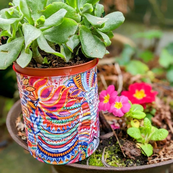 Decorative plant pot perfect for small plants, herbs, or flowers. Unique, lightweight, and durable