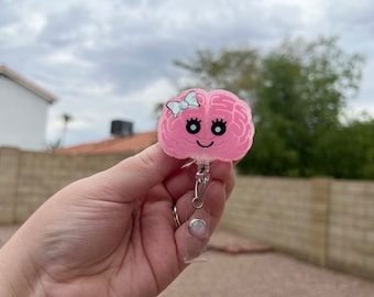 Brain with Bow Badge Reel