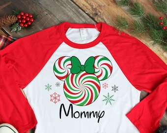 May include: White and red baseball tee shirt with a candy cane Mickey Mouse design and the word "Mommy" printed on the front.