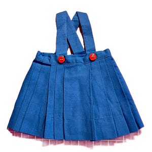 Chatty Cathy Pleated Skirt with Straps. Handmade by me. Royal Blue color, cotton skirt. Made for Chatty Cathy and fits the 18&quot; dolls.