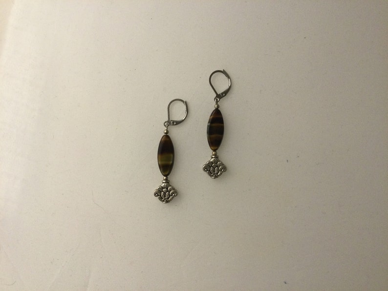 Striped agate pendant earrings and worked metal insert