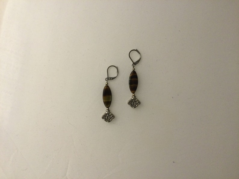 Striped agate pendant earrings and worked metal insert