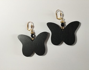 Black wooden pendant earrings in the shape of a butterfly