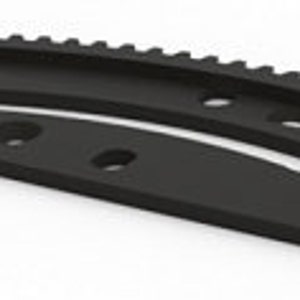 May include: Black plastic gear with a curved shape and multiple holes. The gear has a toothed edge.